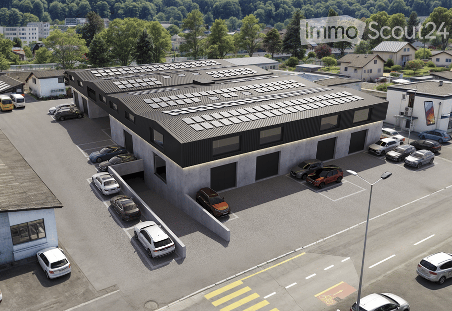 Commercial building with solar panels on the roof, multiple parking spaces, modern design, surrounded by trees and other buildings