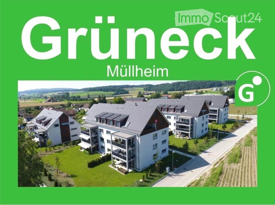 Apartment complex with multiple buildings, balconies, and green surroundings