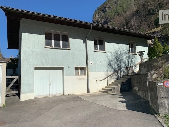 2 story house, blue and white paint, garage, stairs, windows, driveway