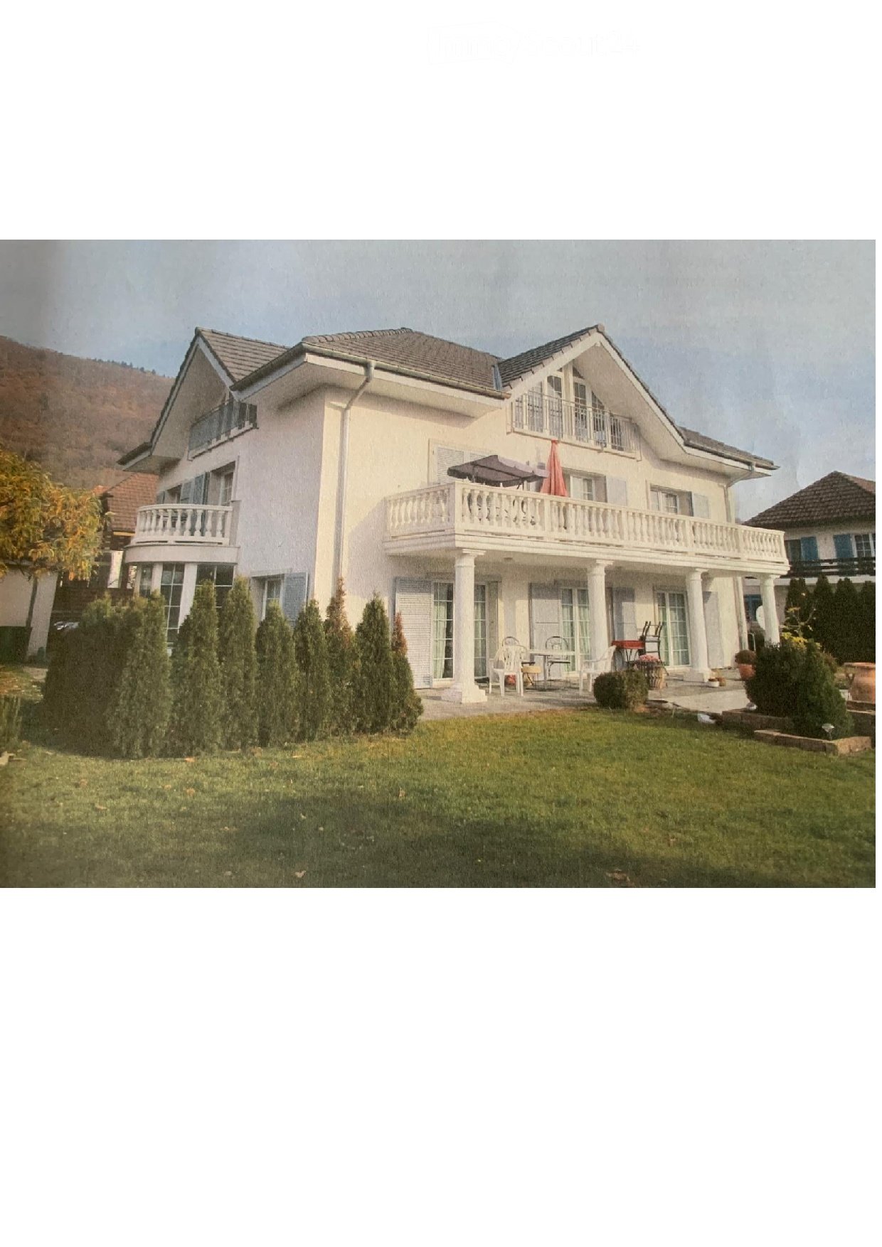 2 story house, white facade, gray roof, balcony, garden