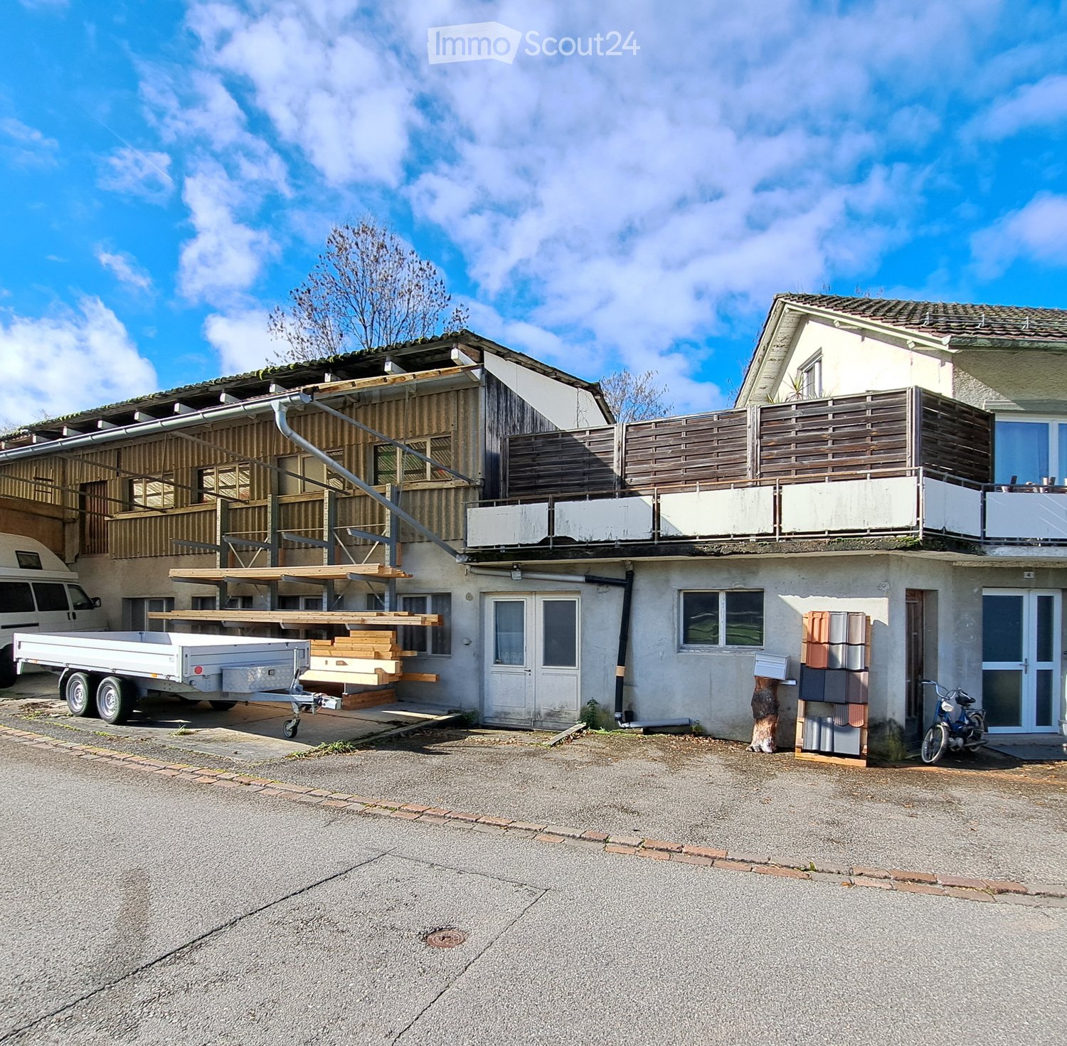 2 story house, balcony, trailer, bicycle, storage boxes