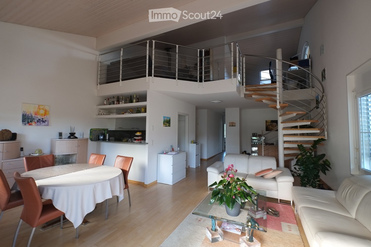 modern interior, dining table, white couches, spiral staircase, balcony, kitchen area