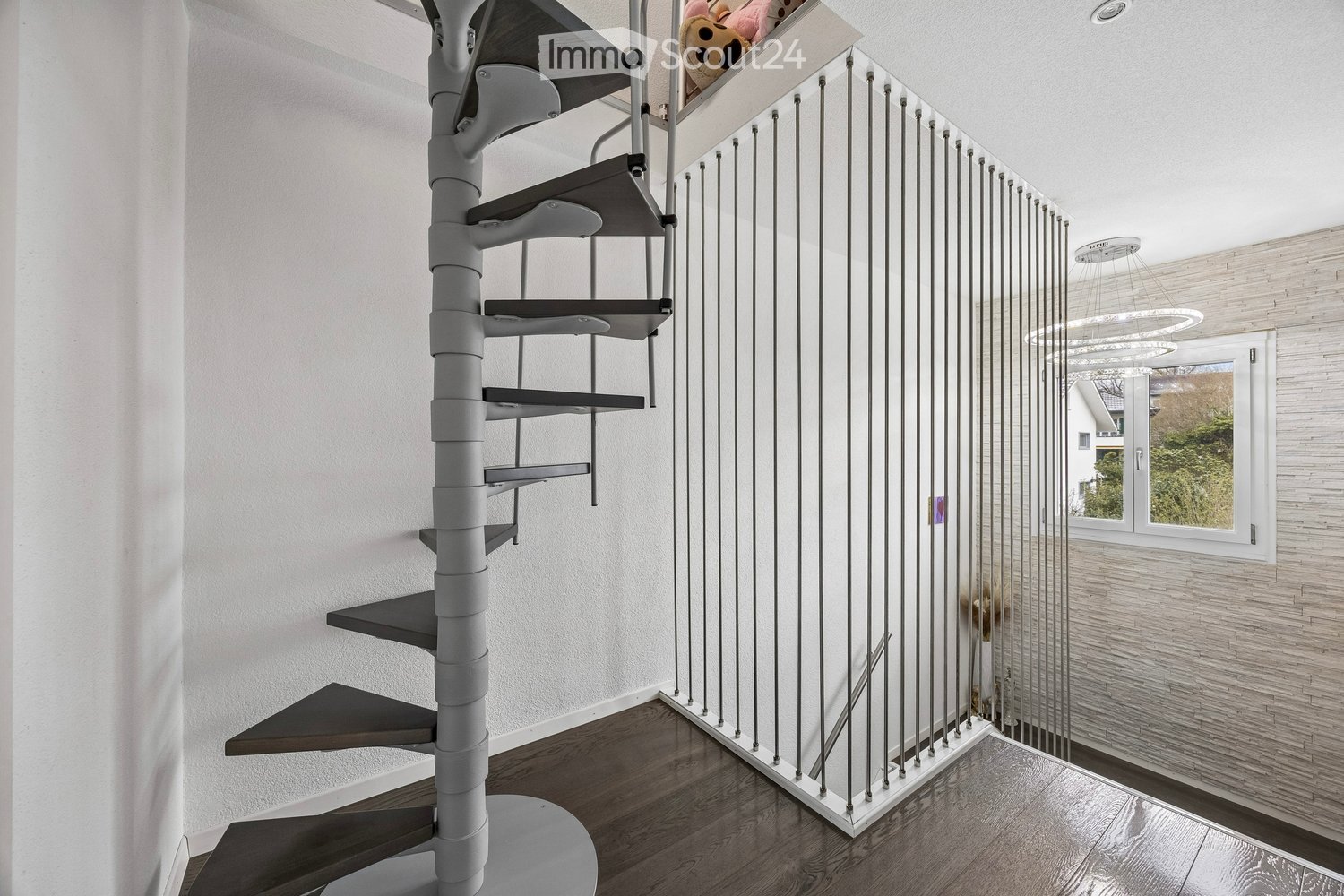 spiral staircase, white walls, wooden floor, white railings, window