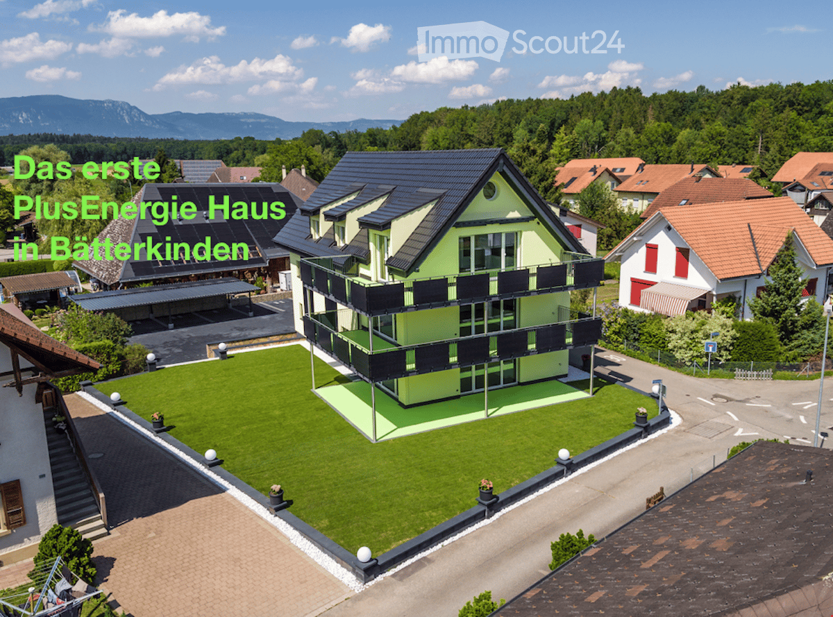 House. Aerial view of a modern house with solar panels, green lawn, and surrounding houses.