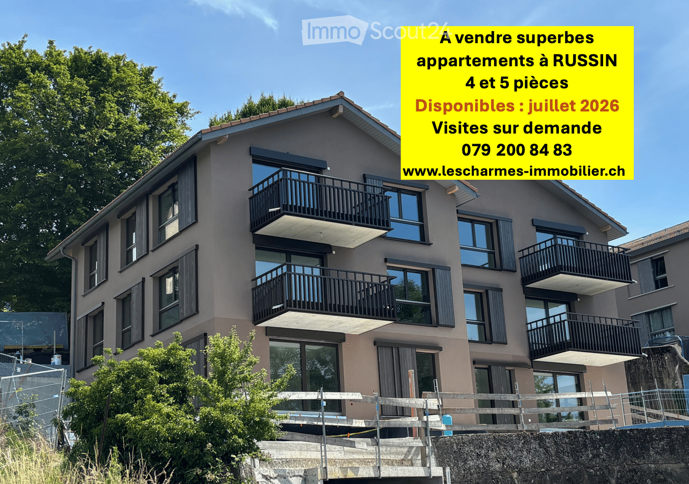 Modern multi-story residential building with balconies, large windows, and a contemporary design.