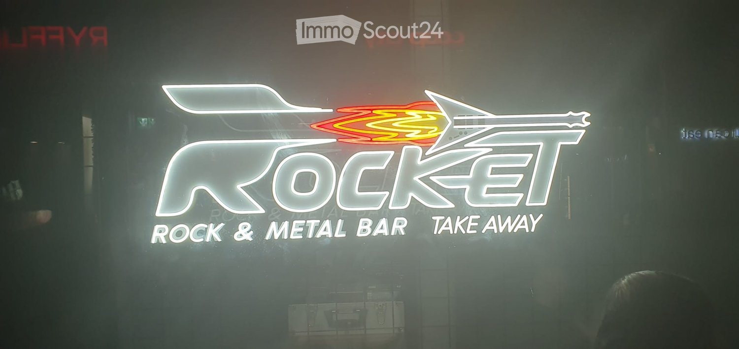 Other. Neon sign for "Rocket" with a stylized rocket design, accompanied by the text "Rock & Metal Bar Take Away" in illuminated letters.