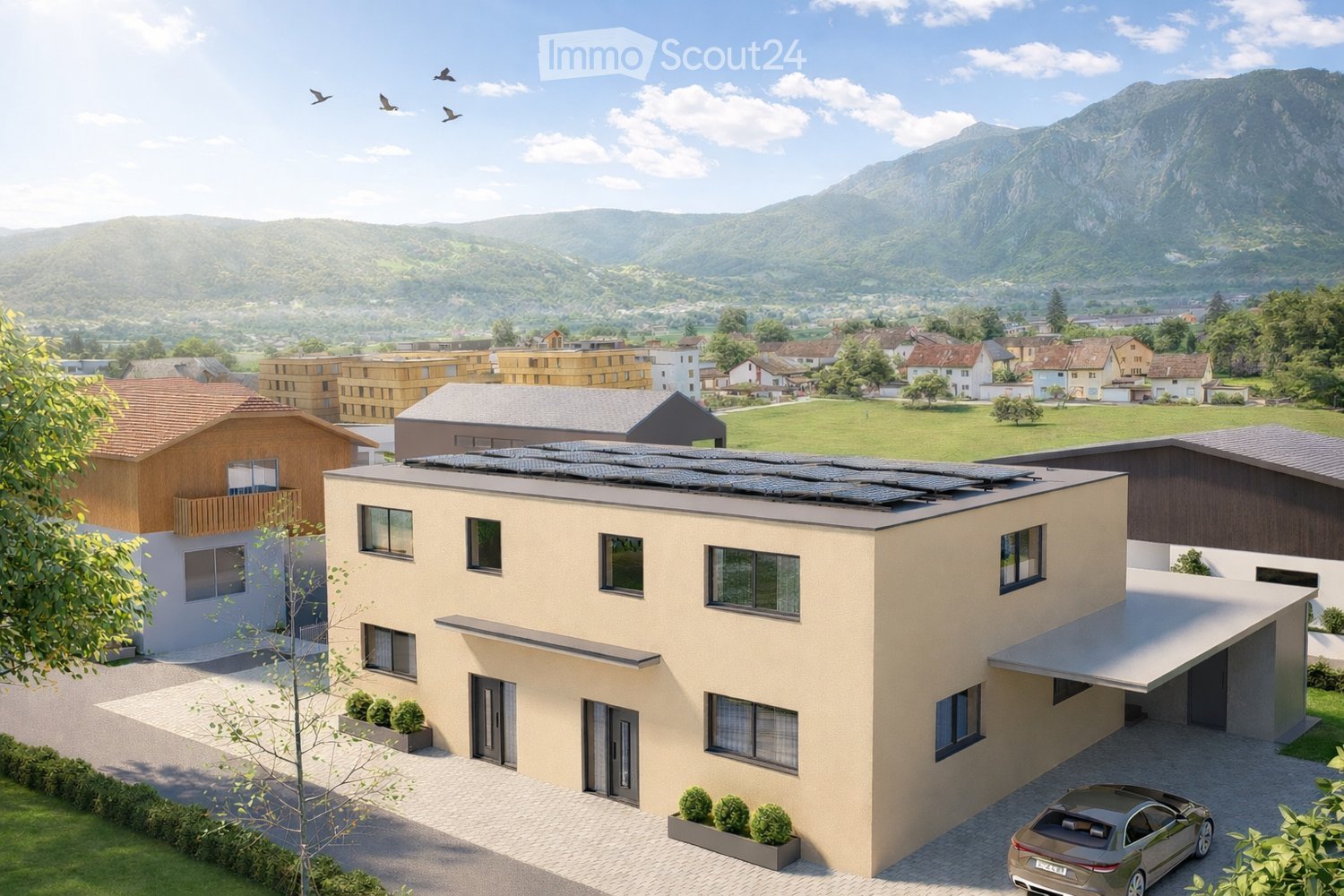 House. A modern two-story house with a flat roof, large windows, and solar panels on the roof. The house is surrounded by a well-maintained garden and is situated in a scenic, mountainous area with other houses and greenery in the background.