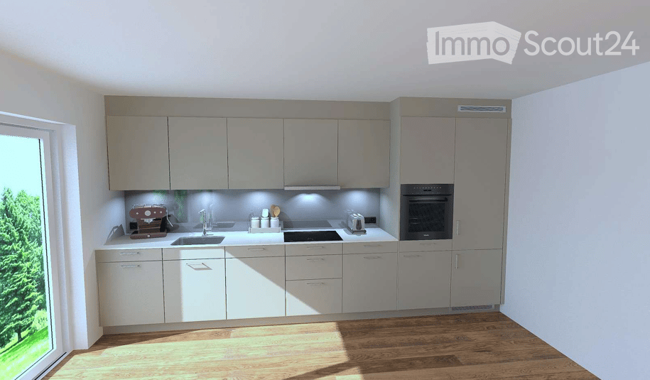 Modern kitchen with light grey cabinets, white countertops, and wooden flooring. Features include a sink, faucet, coffee maker, oven, and toaster.