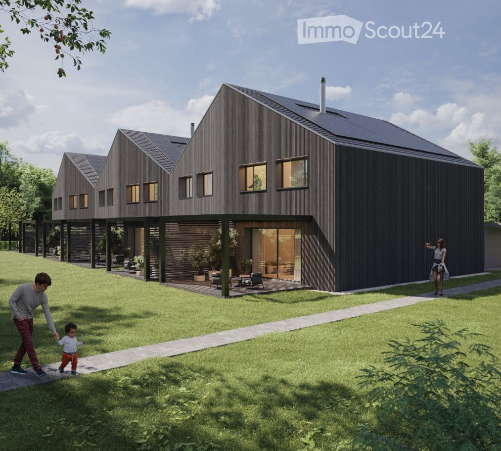 Modern two-story house with dark wooden exterior, multiple windows, and a spacious lawn area.