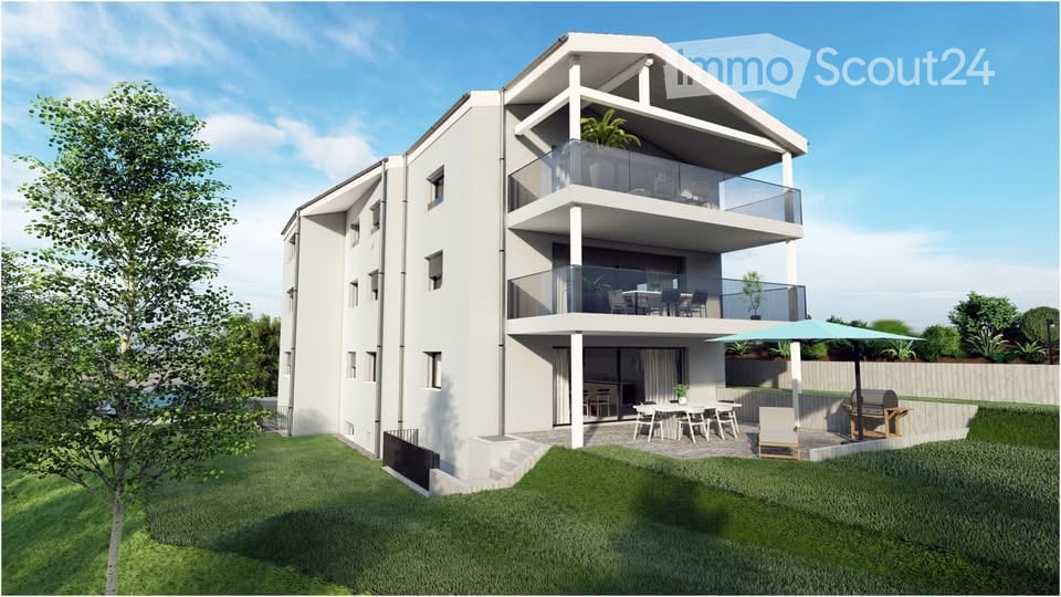 Modern two-story house with white exterior, multiple balconies, and outdoor patio furniture.