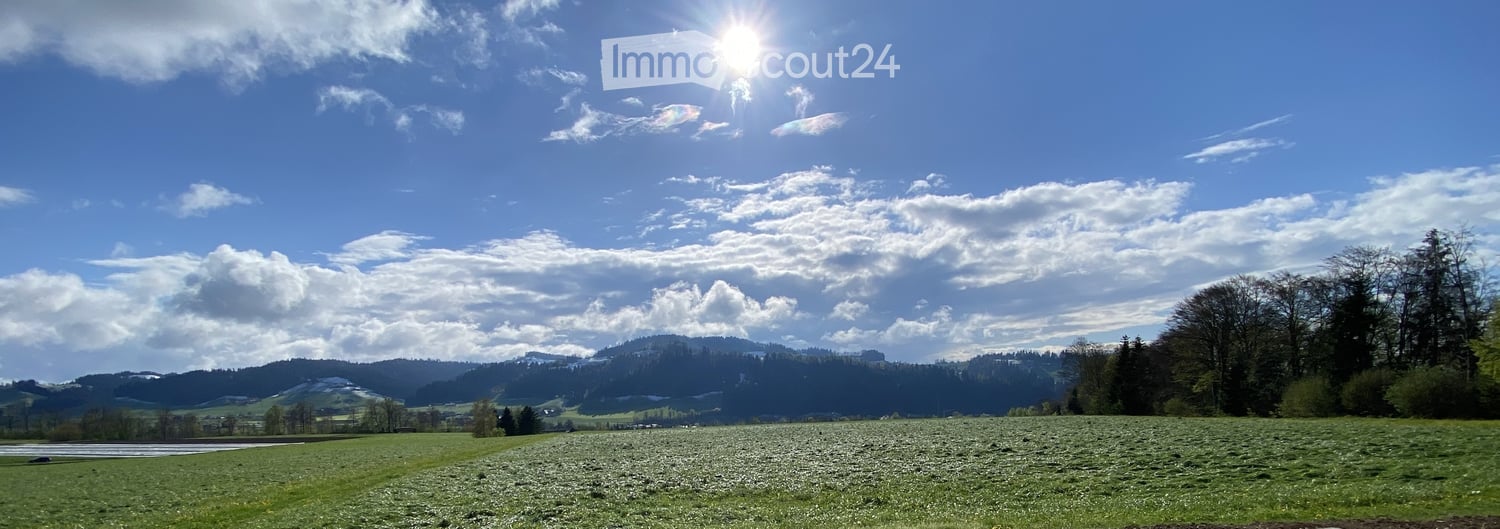 green field, trees, mountains, blue sky, clouds
