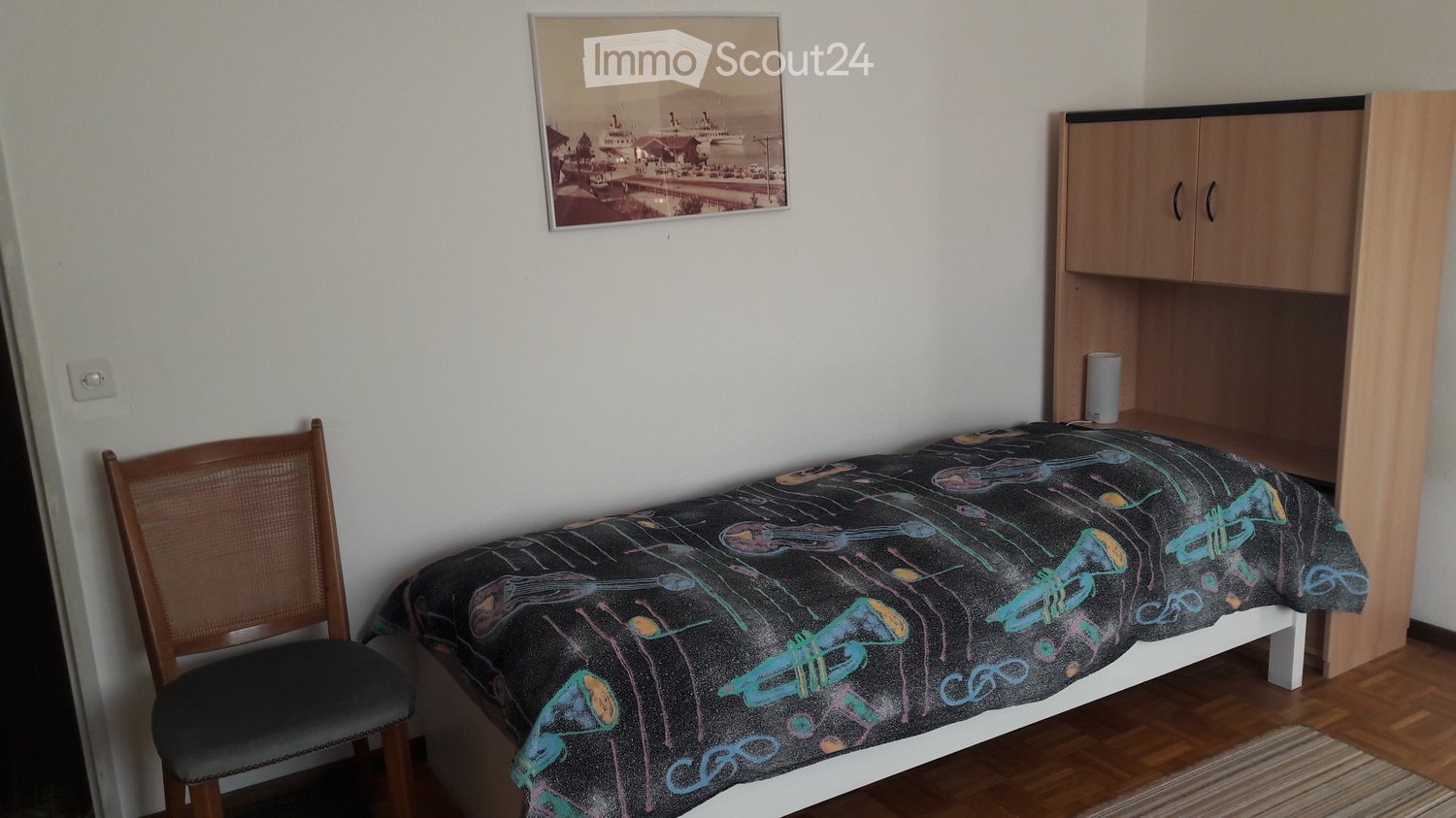 bedroom, single bed, nightstand, picture frame, wooden chair, wooden cabinet