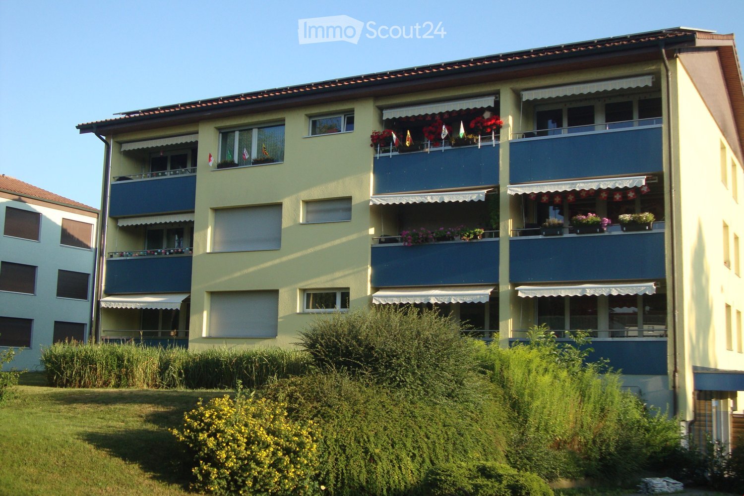 yellow building with multiple balconies
