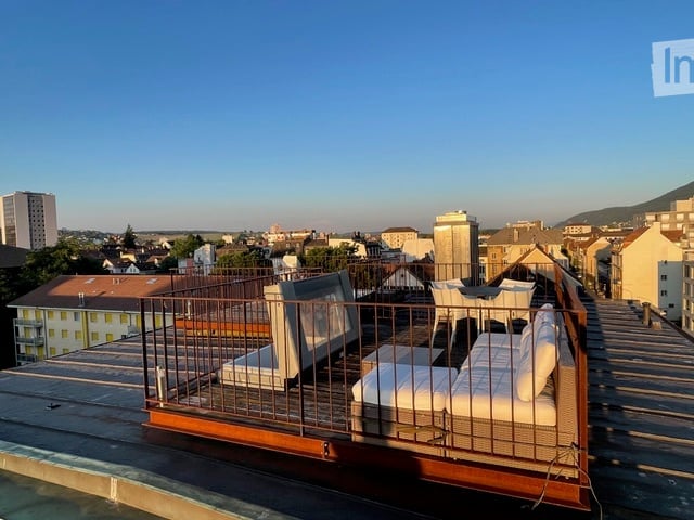covered terrace, white furniture, wrought iron railing, rooftop view
