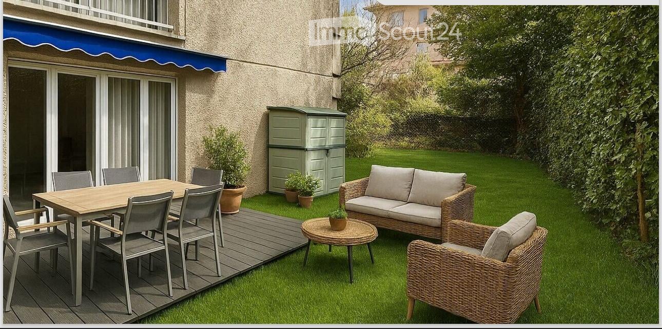 Outdoor patio area with a wooden dining table, chairs, wicker sofa, and small round table. Green storage shed and potted plants are visible.