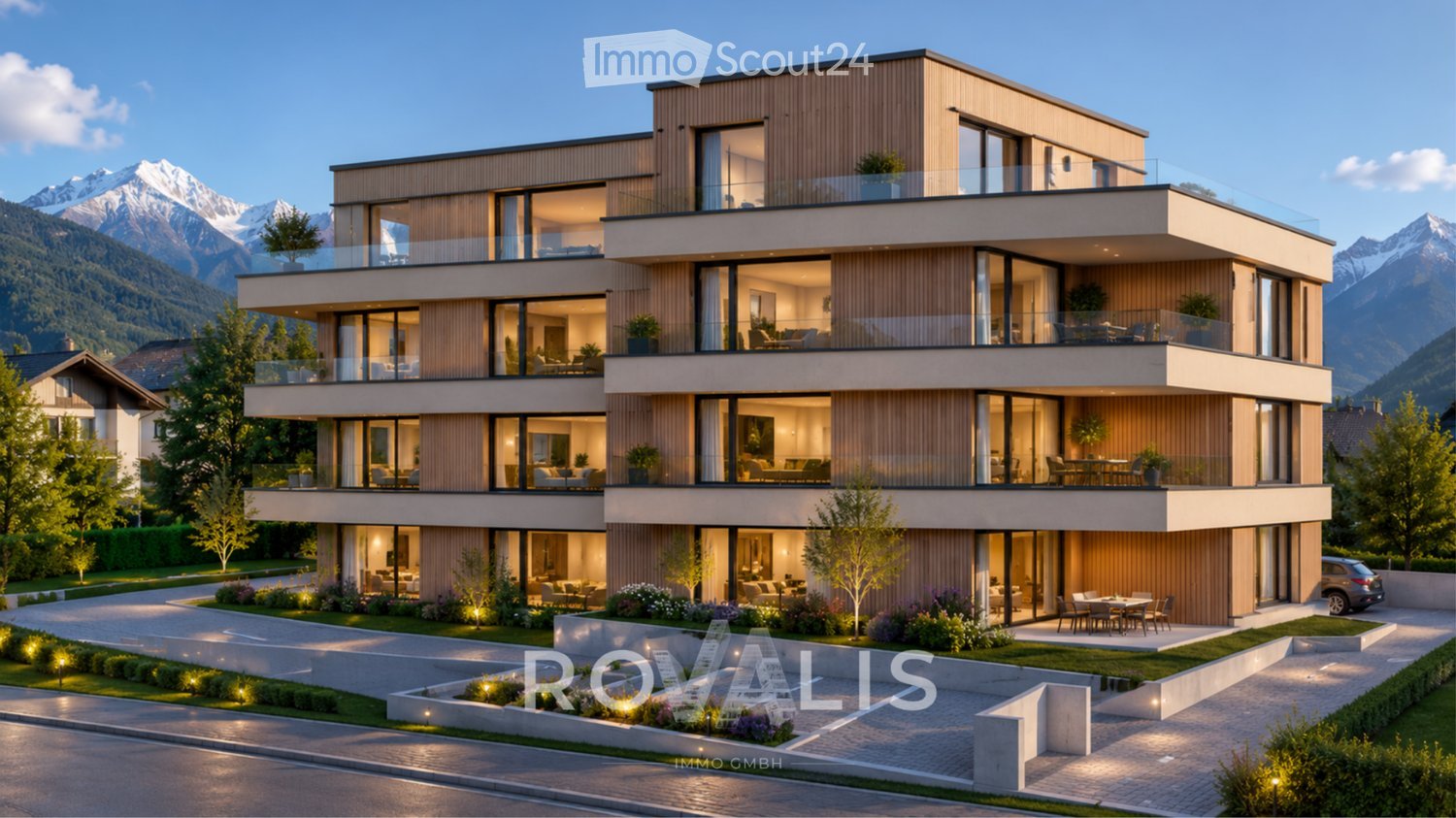 Modern3-story house with large windows, balconies, and a scenic mountain view in the background.