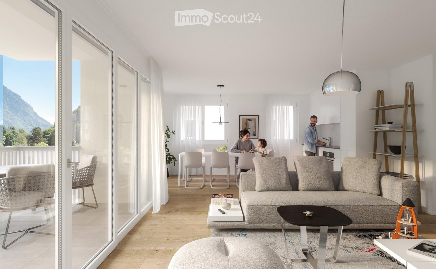 Bright, modern living room with large windows offering a scenic mountain view. Features a grey sectional sofa, coffee table, ottoman, dining area with chairs and table, pendant lights, and a kitchen area with a sink and shelves.