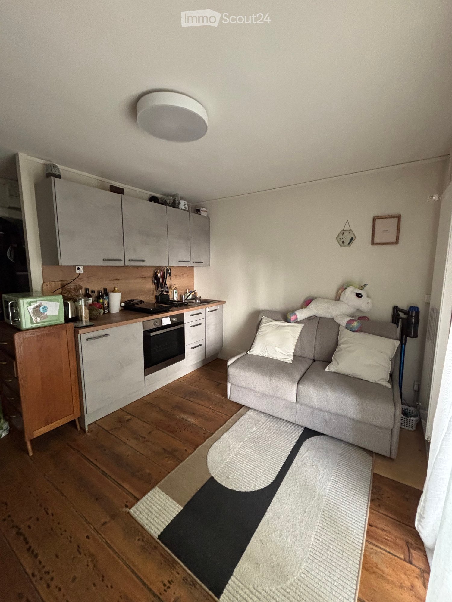 {"type": "Furnished Room", "objects": ["sofa", "oven", "microwave", "cupboard", "faucet", "stool", "cup", "bottle", "fridge", "stool", "stool", "stool", "stool", "stool", "stool", "stool", "stool", "stool", "stool", "stool", "stool", "stool", "stool", "st
