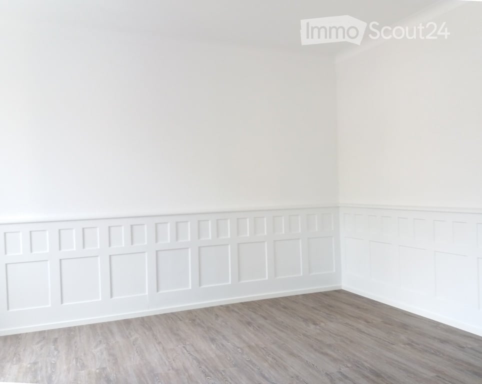 Completely empty room with white walls and light wooden flooring. No furniture or equipment.