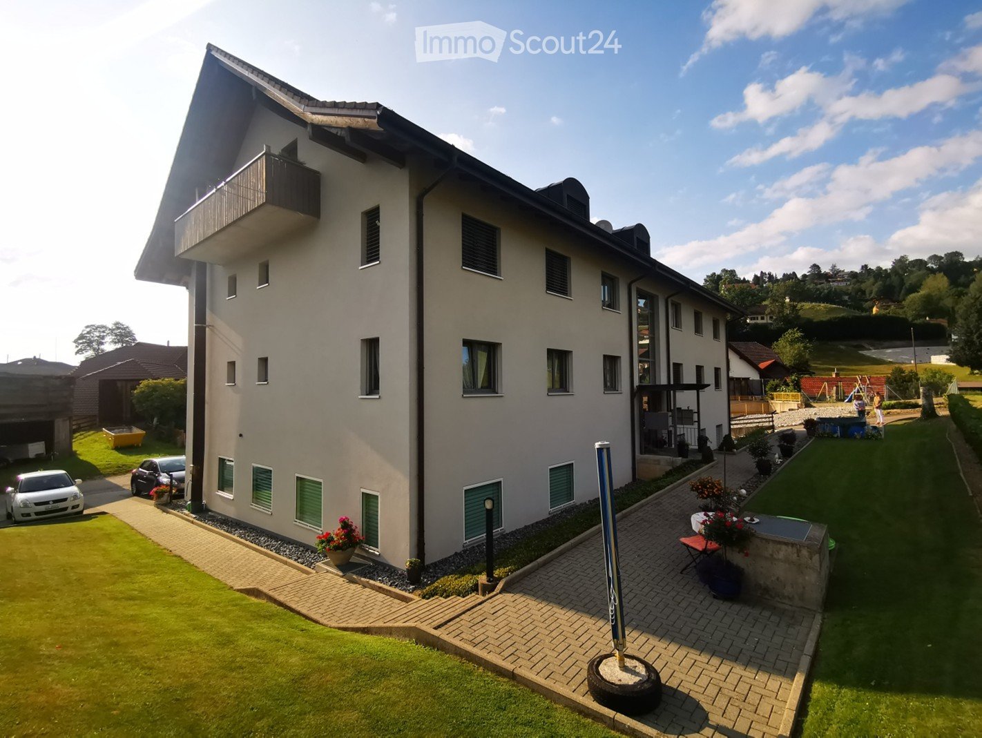 3 story house, white exterior, green shutters, balcony, garden, parking