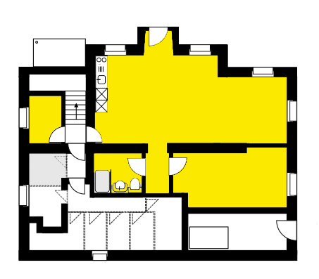 Floor plan of a multi-room residential space with a large central living area, multiple bedrooms, bathrooms, and a kitchen.