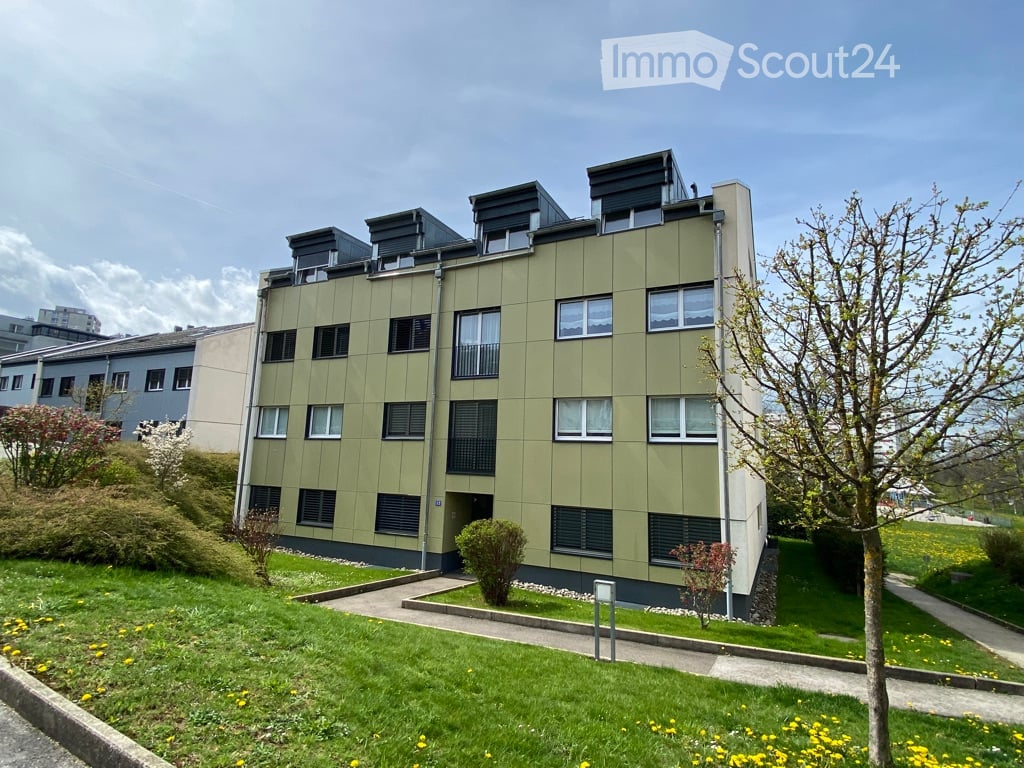 apartment building, multiple windows, entryway, exterior wall with greenery