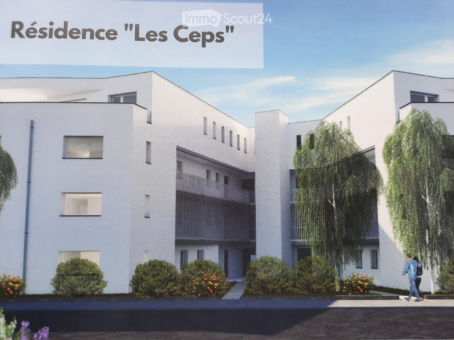 Modern multi-story residential building with white facade, large windows, and greenery around the entrance.