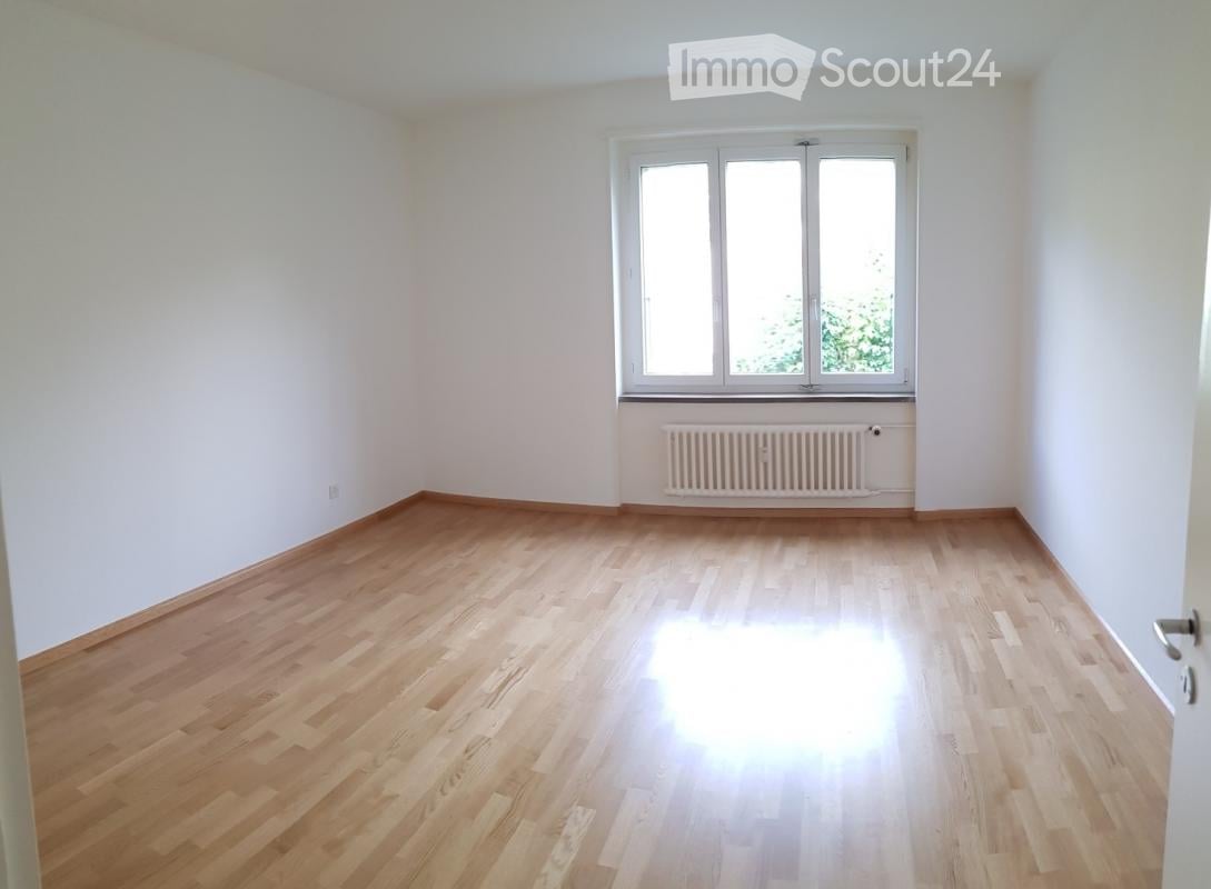 Completely empty room with bare walls and wooden floor. No furniture or equipment.
