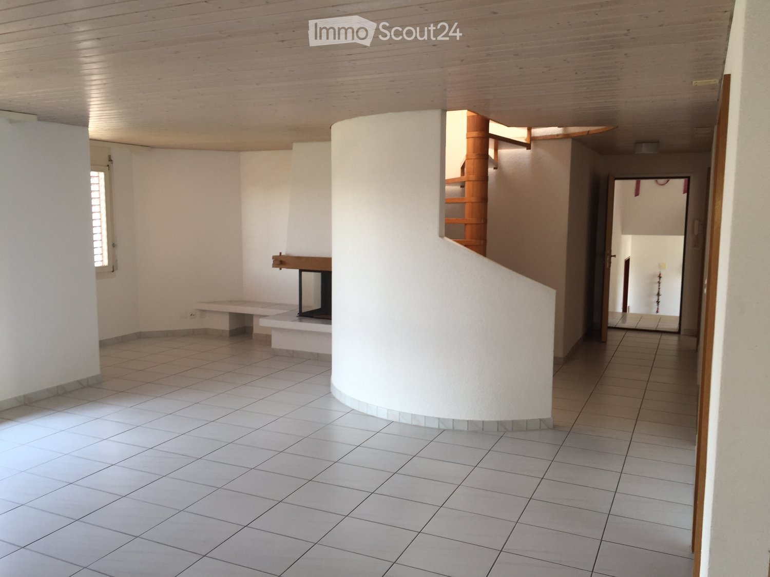 empty room, white tiles, fireplace, spiral staircase, window