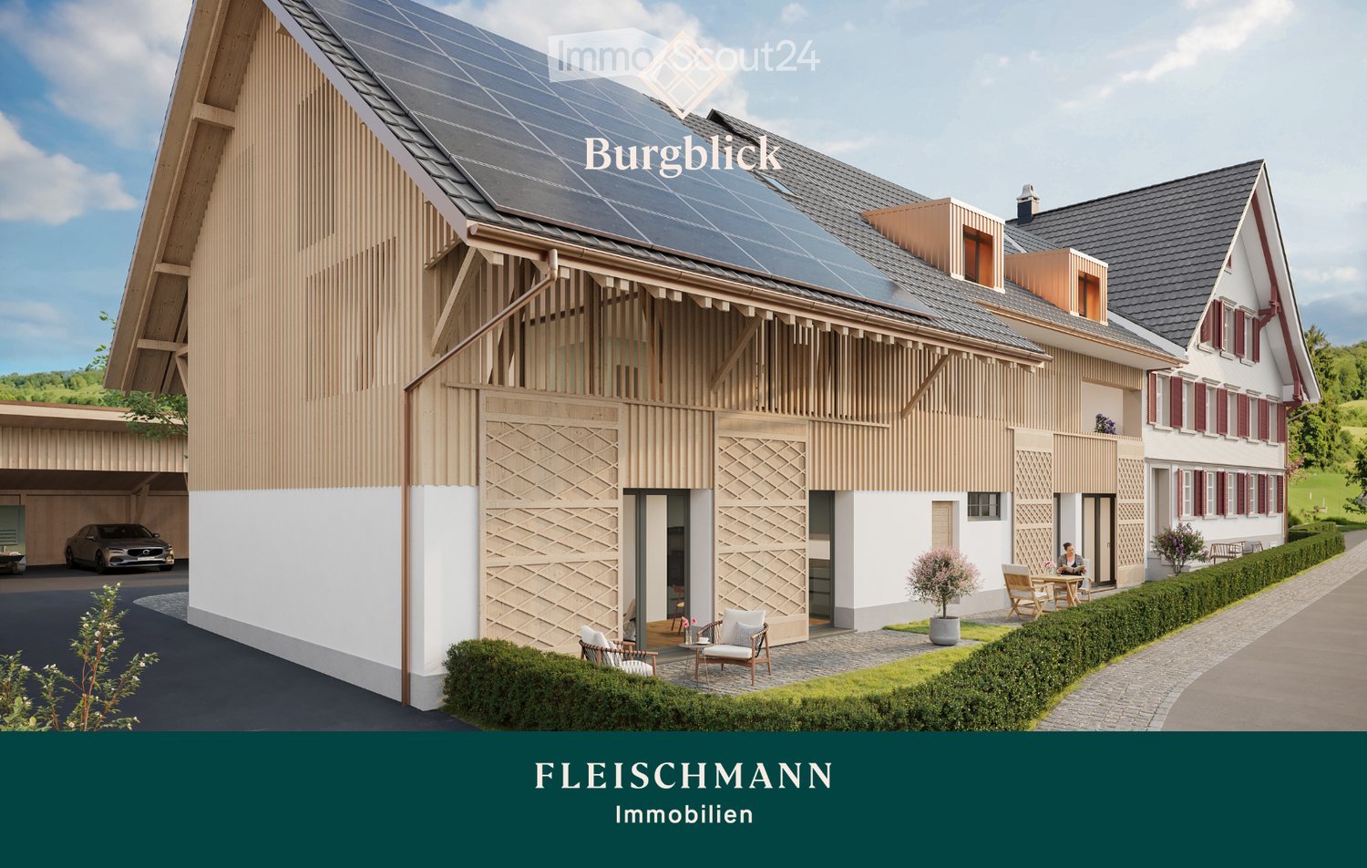 Modern two-story house with solar panels on the roof, wooden facade, and a balcony area with outdoor seating. The house features a garage and is surrounded by a well-maintained garden.