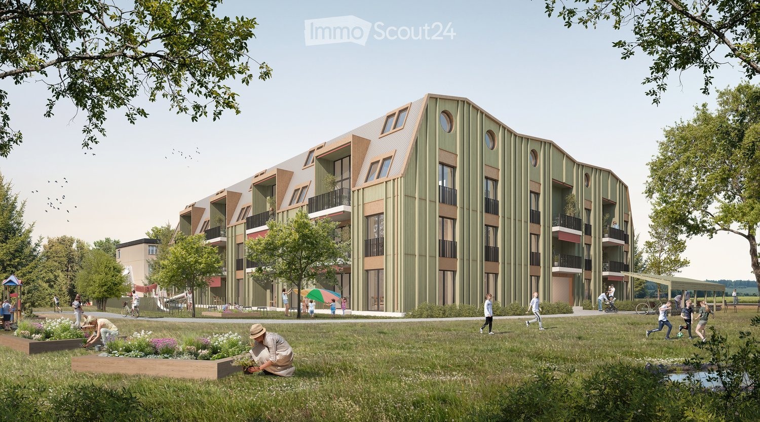 Modern multi-story residential building with green facade and balconies, surrounded by a park area with children playing and people walking.