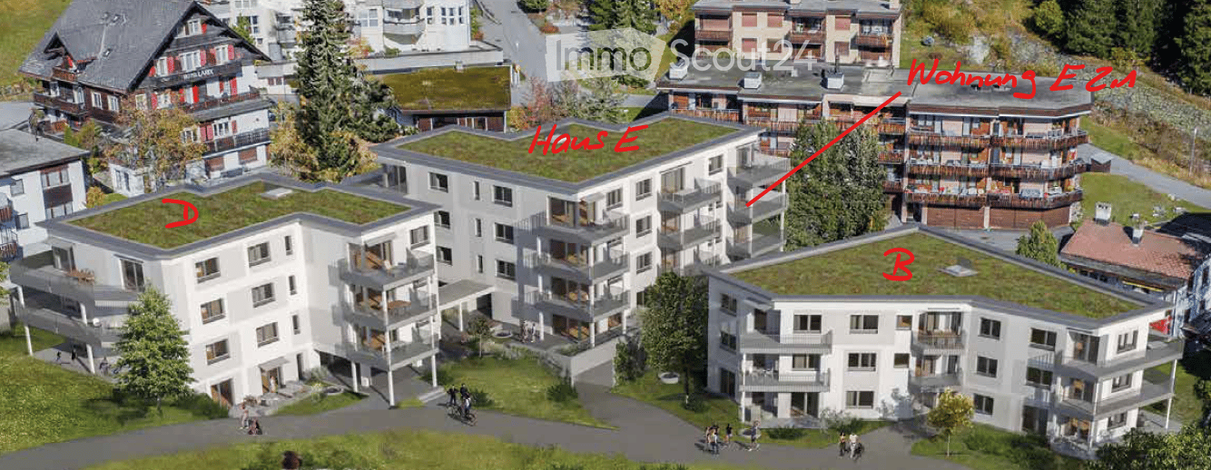 Aerial view of a modern residential complex with multiple buildings, green roofs, balconies, and surrounding greenery.