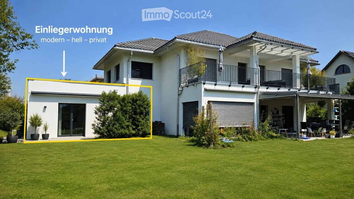 Modern two-story house with white exterior, grey roof, large windows, balcony, and well-maintained garden.