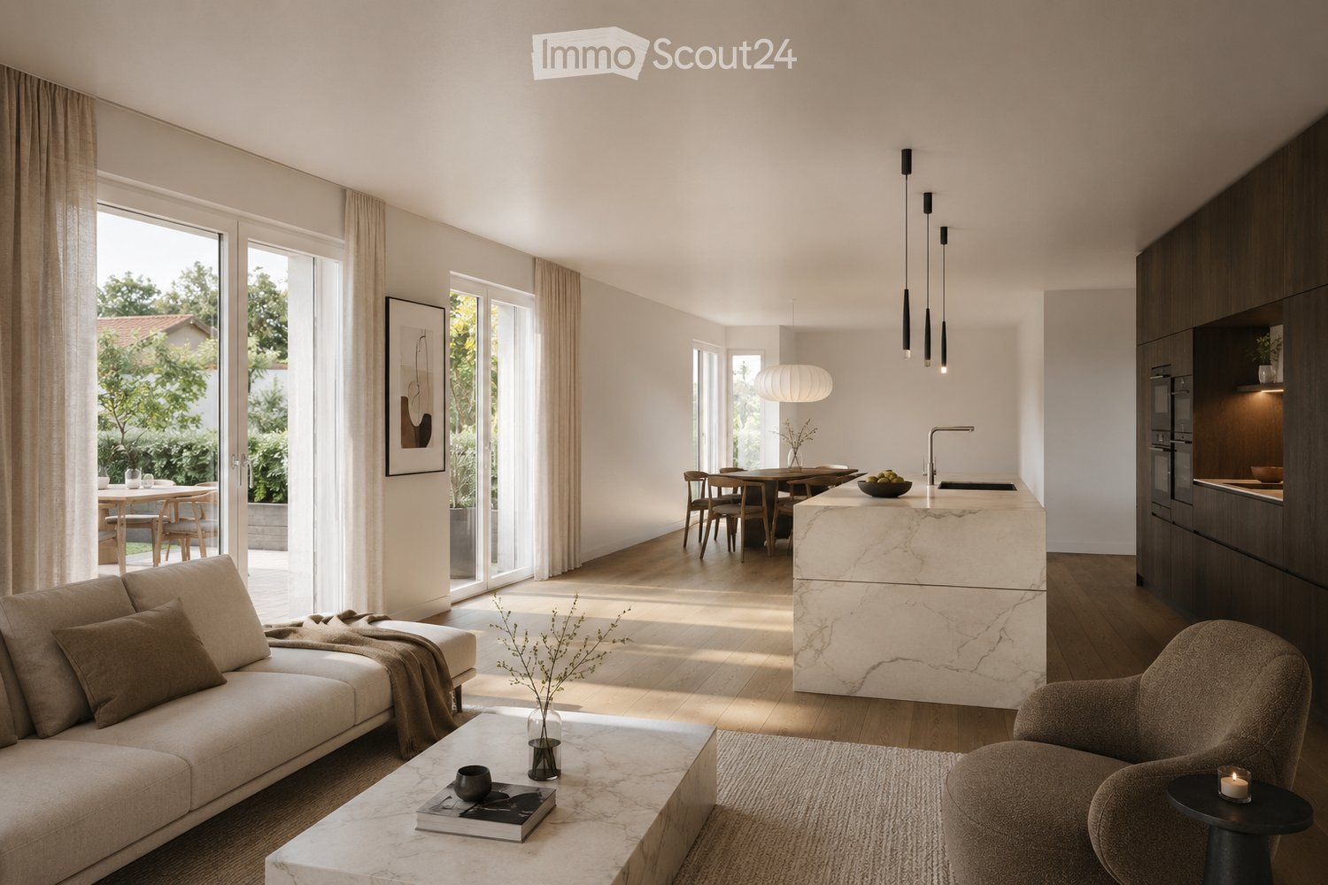 Open-plan living and dining area with a modern sofa, coffee table, dining table, and kitchen island. Features pendant lights, a vase with dried flowers, and a bowl on the island.