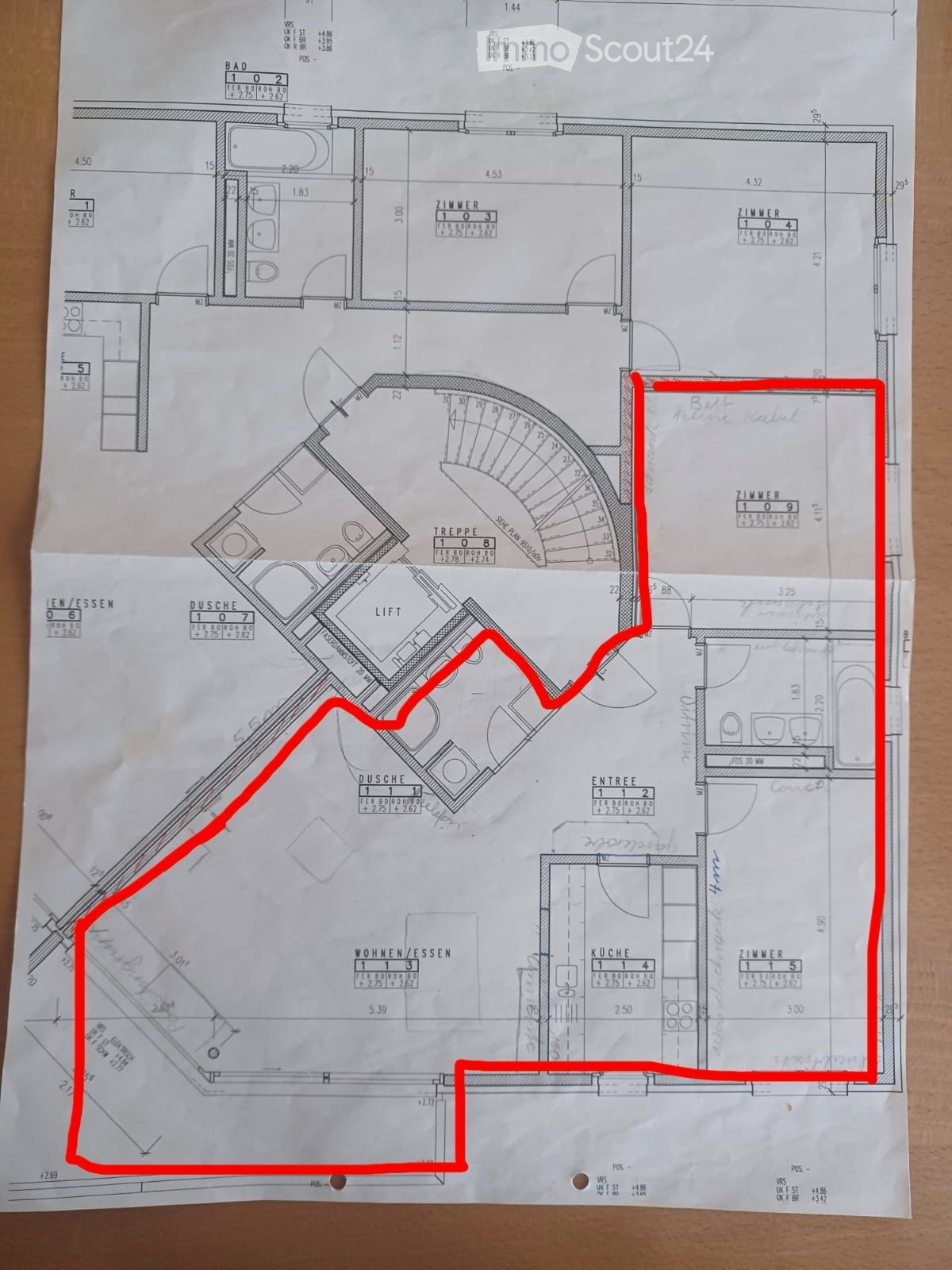 Floor plan of a residential space showing multiple rooms including a kitchen, living/dining area, bedrooms, bathrooms, and a staircase. Dimensions and room labels are visible.