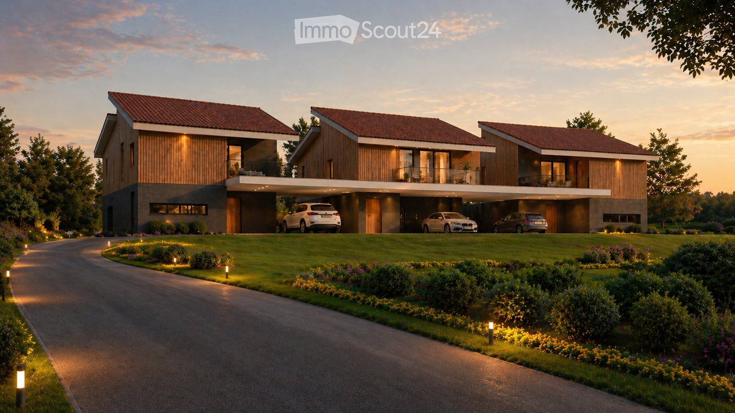 Three modern houses with wooden exteriors, red roofs, and balconies. Each house has a garage with a car parked in front. The houses are surrounded by a well-maintained lawn and garden with various plants and trees.