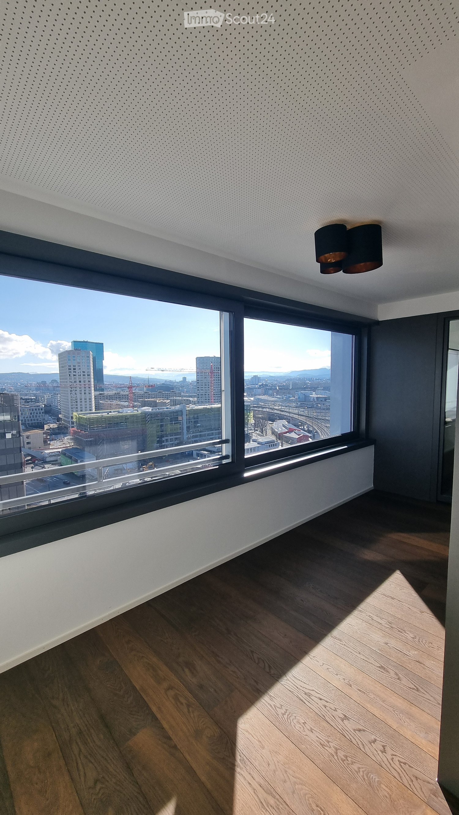 large windows, wooden floor, modern design, city view