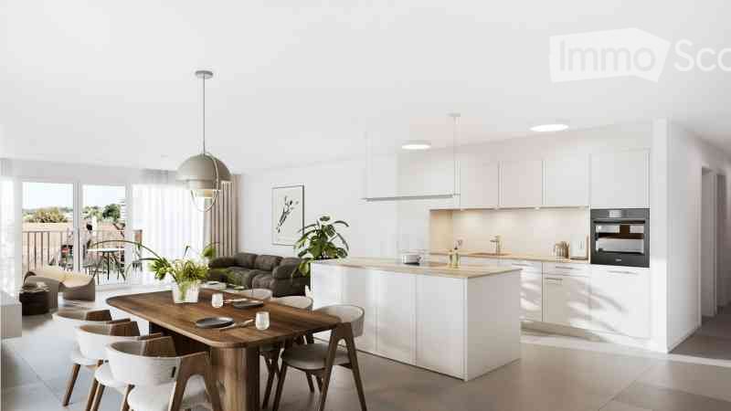 Open-plan living and dining area with a modern kitchen, white cabinets, a wooden dining table with chairs, a sofa, and a pendant light. Large windows and a balcony are visible.