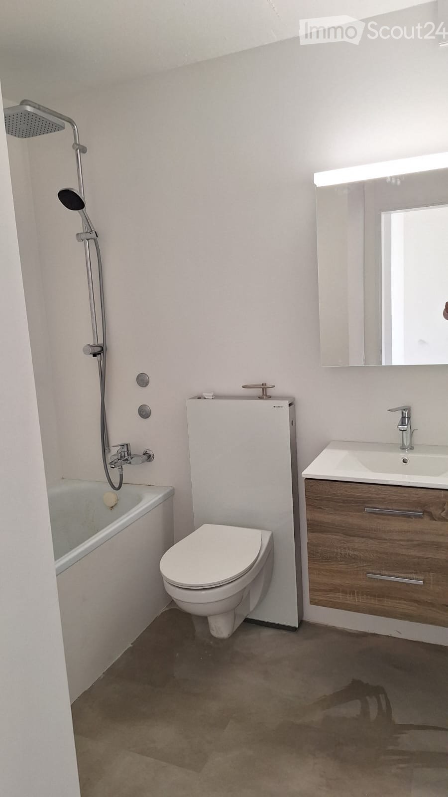 modern bathroom, white bathtub, white toilet, wooden vanity, mirror
