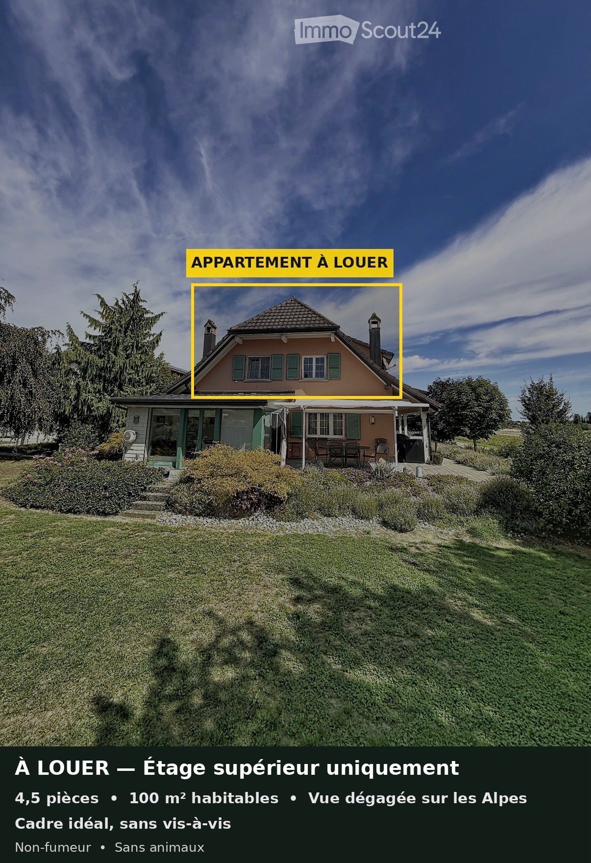 Two-story house with a pink facade, green shutters, and a well-maintained lawn. The house features a porch with outdoor furniture and a clear view of the surrounding landscape.