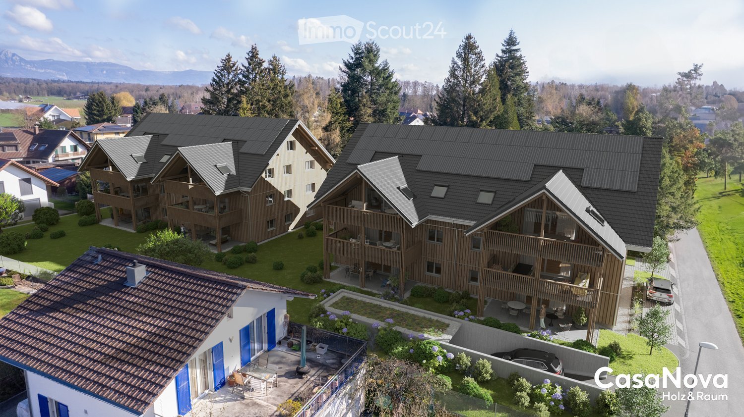 Aerial view, modern house design, raised ground floor, terrace, large windows, multiple balconies, green landscaping, solar panels, distant mountain view