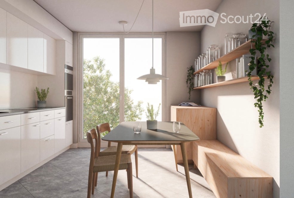 Modern kitchen with white cabinets, a dining table with chairs, pendant light, and open shelving with glass jars and plants.