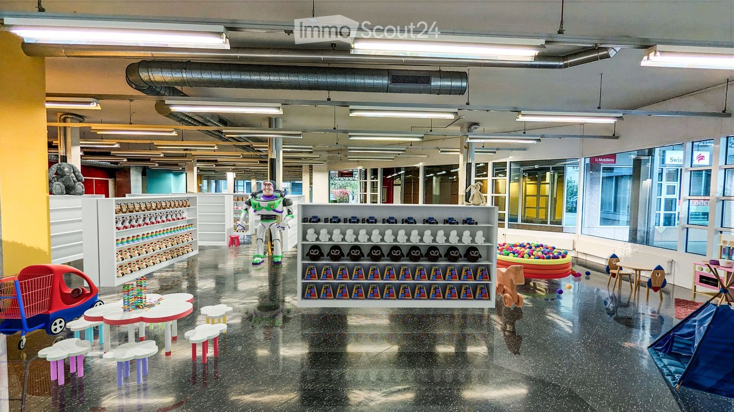 Bright, modern children's play area with colorful furniture, shelves filled with toys, a ball pit, and a play tent.