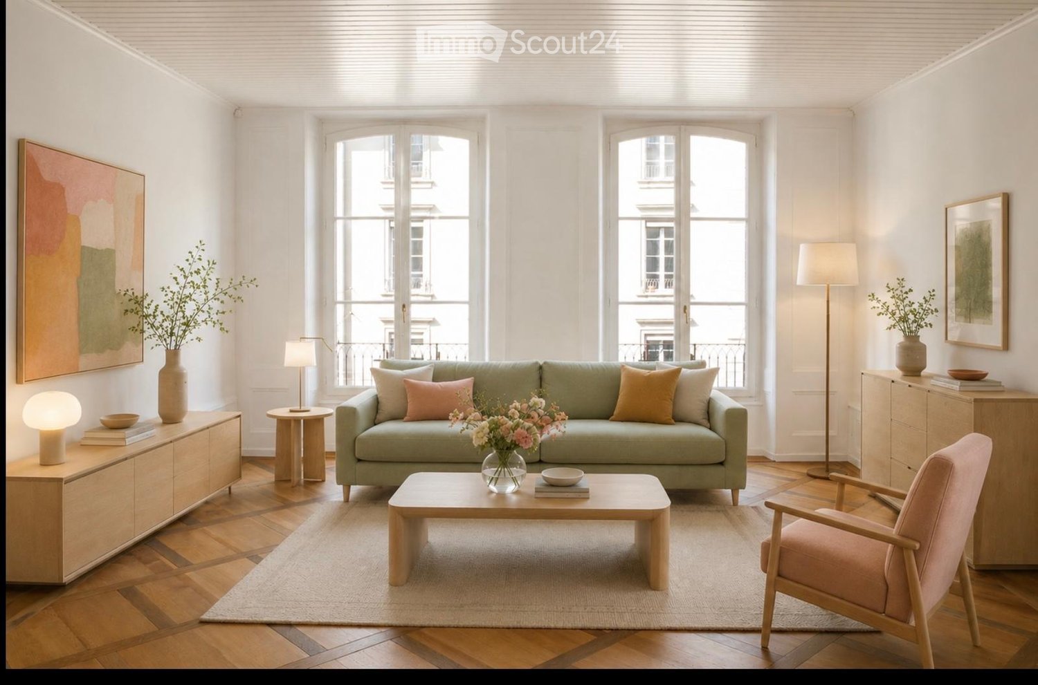 Modern living room with light green sofa, wooden coffee table, pink armchair, side tables, floor lamp, and decorative vases.