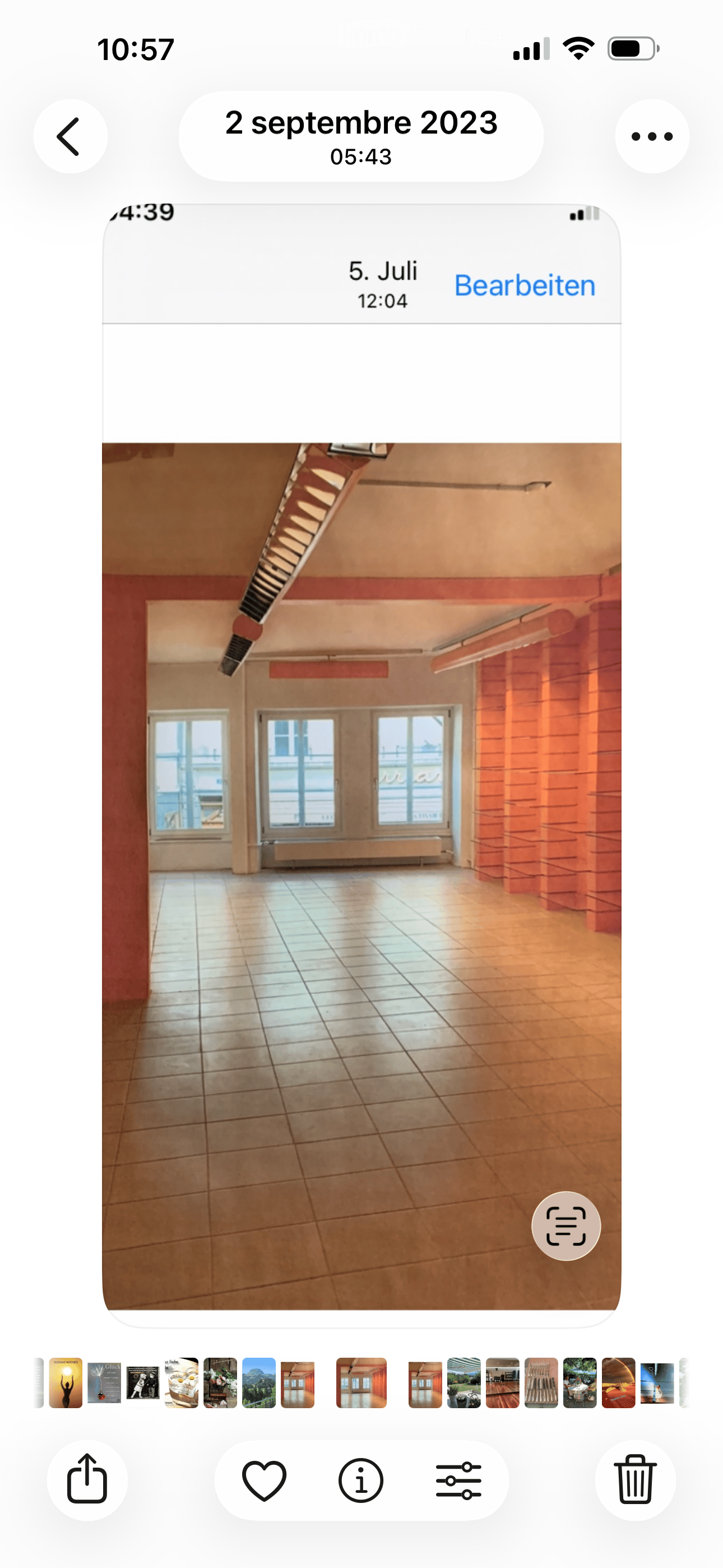 Empty room with tiled floor, large windows, and exposed brick wall. No furniture or equipment visible.