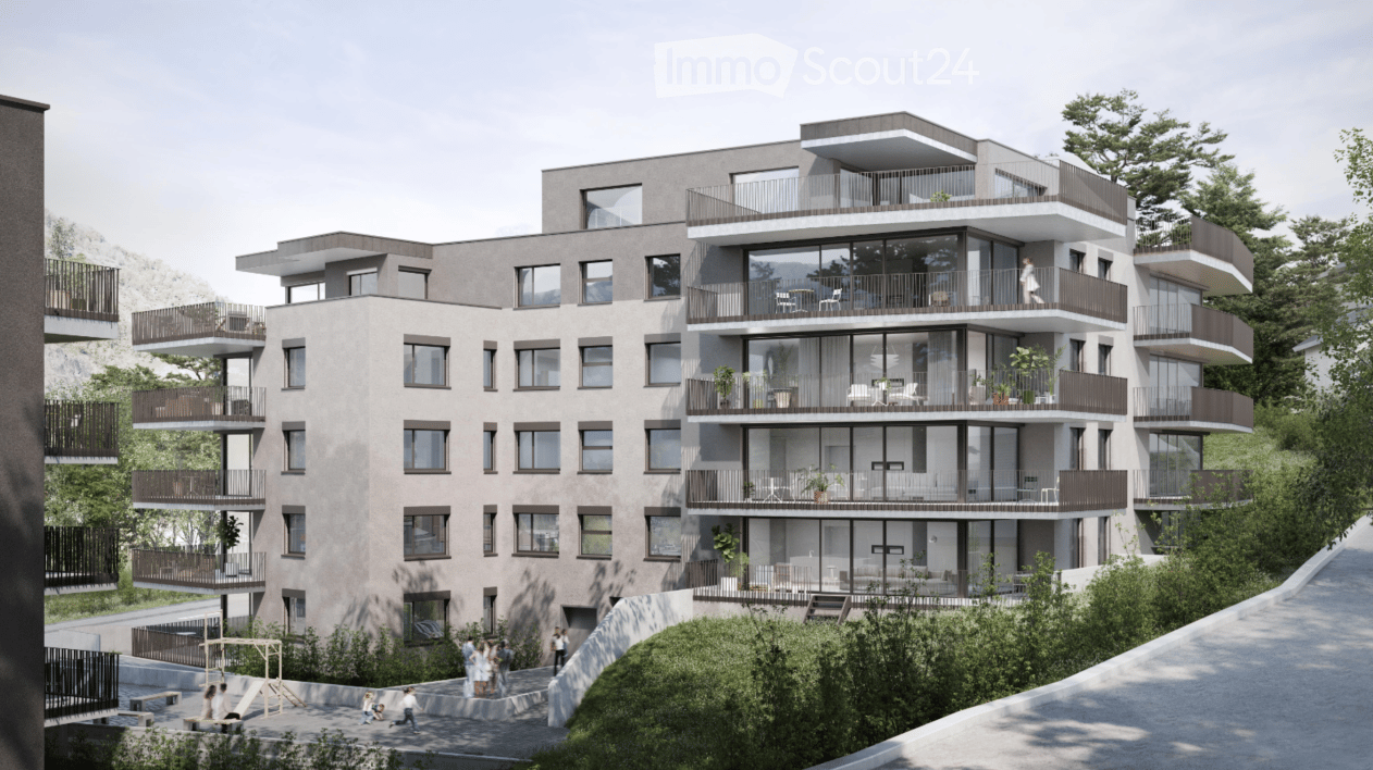 Modern multi-story residential building with balconies, large windows, and contemporary design, surrounded by greenery and a pathway.