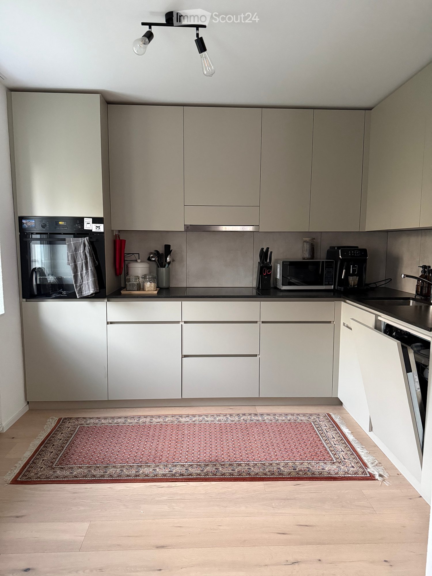 {"type": "Kitchen", "objects": ["oven", "microwave", "coffee maker", "faucet", "sink", "cupboard", "kitchen island", "kitchen utensils", "oven mitt", "oven gloves", "oven rack", "oven tray", "oven door", "oven handle", "oven light", "oven control panel",