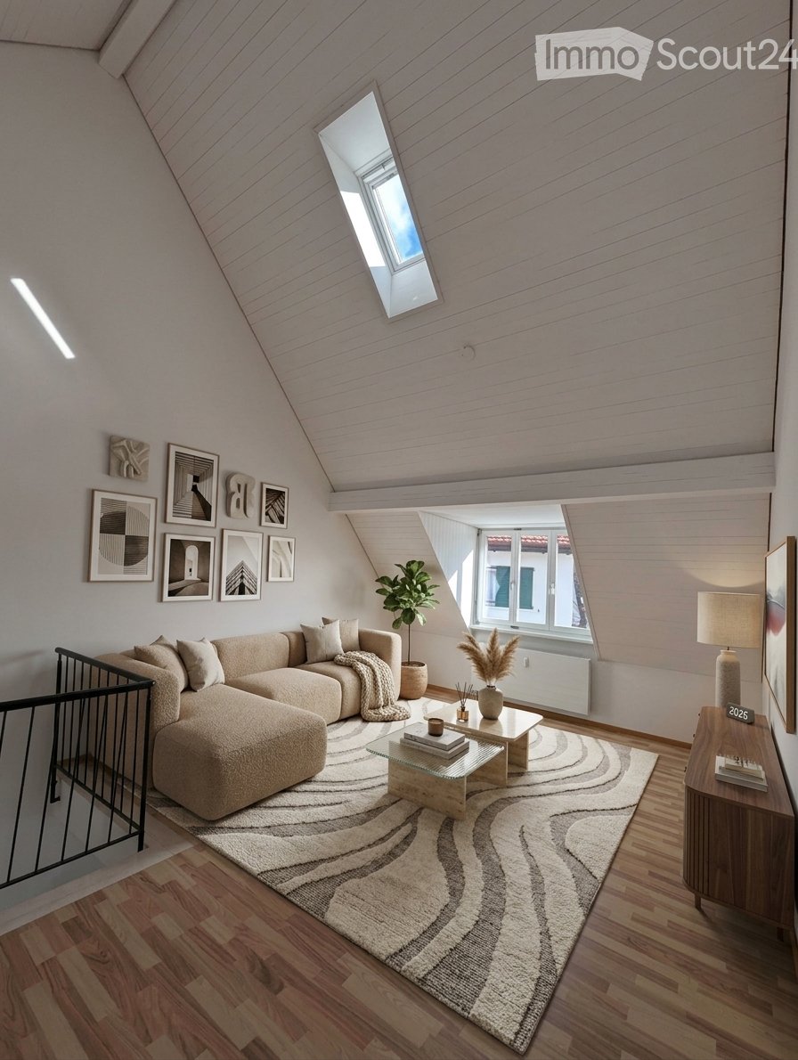Modern living room with a sectional sofa, coffee table, side table, floor lamp, plant, and picture frames on the wall. The room features wooden flooring and a large skylight.