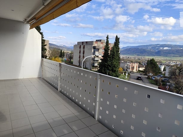 tiled floor, metal railing, balcony, view of the city and mountains