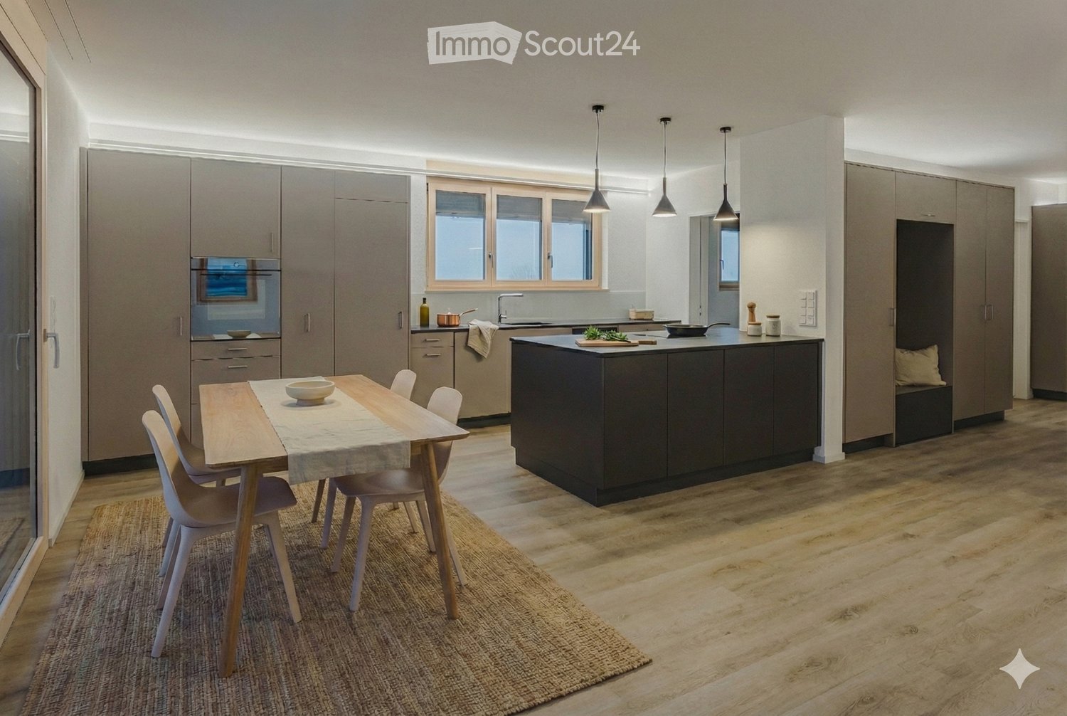 Open kitchen with island, large table with chairs, wooden floor, grey cabinets, modern appliances, window